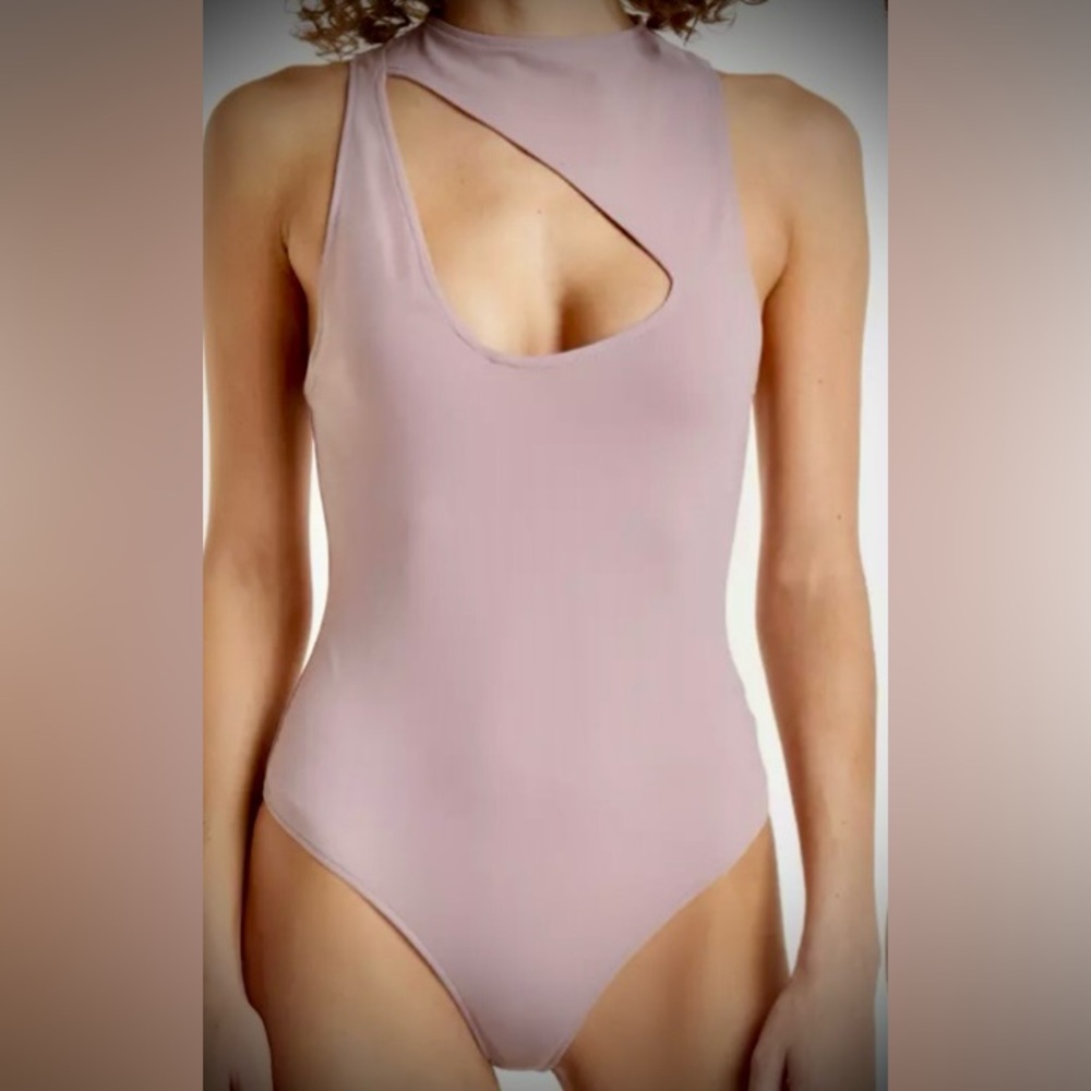 NWOT…FREE PEOPLE Keep It Going Bodysuit